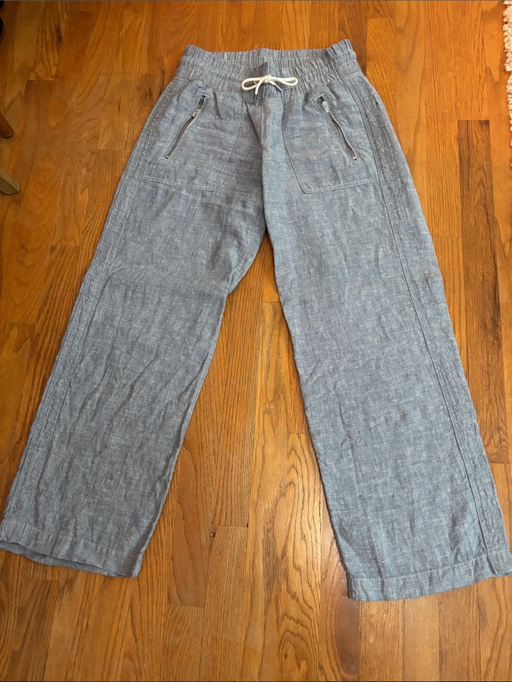 Athleta Wide Leg Linen-Blend Pants in Light Blue with zippered pockets.